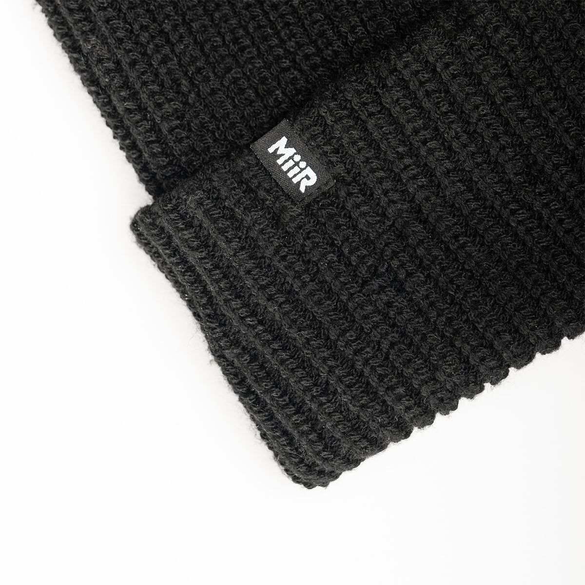 recycled-poly-rib-beanie-b5 WebPDP-RecycledPolyRibBeanie_Studio_TagDetail_Black__BNE002002OS.jpg